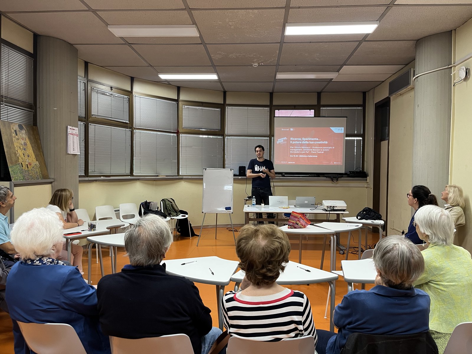 Pier Vittorio Mannucci presenting to the audience at one of the workshops